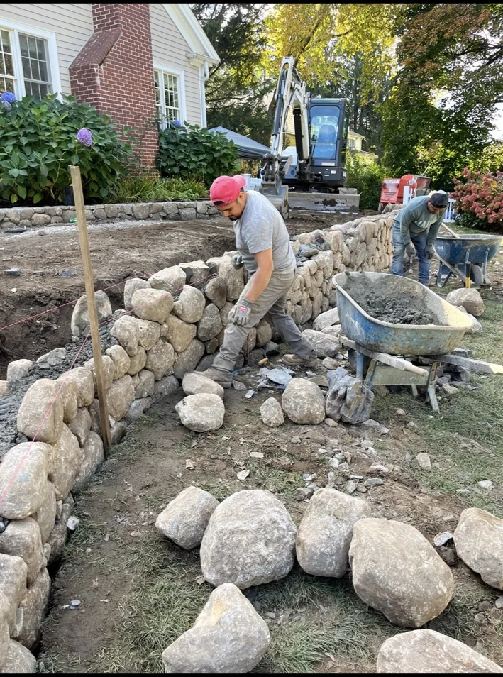 Stone wall construction in progress