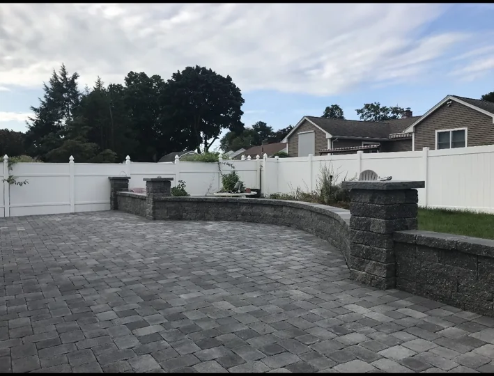 Curved paver patio and seat wall